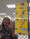 Close-up of caged Karen with ransom note.