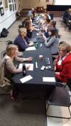 Long table with the following people (front to back) talking one-to-one across from each other: Abbey Rimel with Leslie Bowman, Linda Vincent with Laura Williams, Mary K. Davis with Kathleen Nuss, (can't make out who) with Stephanie Wambaugh, there are more, but can't make them out.